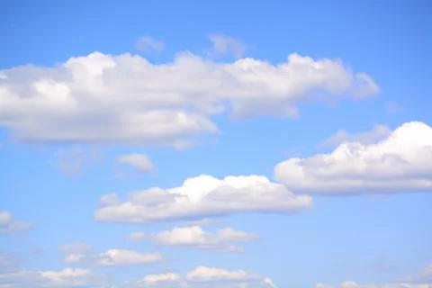 Fluffy cloud in a saturated blue sky.	11 Stock Photos