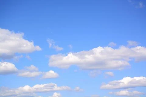 Fluffy cloud in a saturated blue sky.	10 Stock Photos