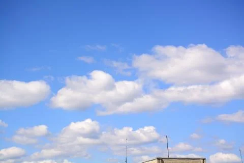 Fluffy cloud in a saturated blue sky.	9 Stock Photos