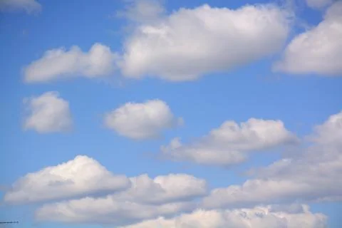 Fluffy cloud in a saturated blue sky.	6 Stock Photos