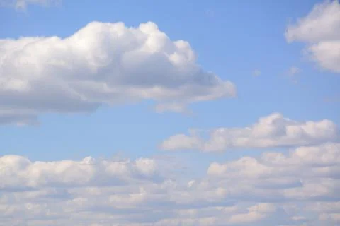 Fluffy cloud in a saturated blue sky.	5 Stock Photos