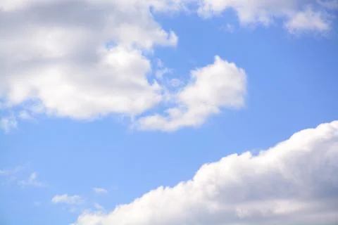 Fluffy cloud in a saturated blue sky.	3 Stock Photos