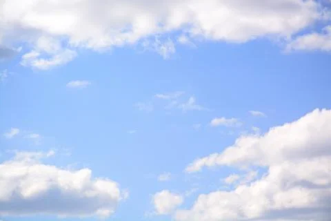 Fluffy cloud in a saturated blue sky.	2 Stock Photos