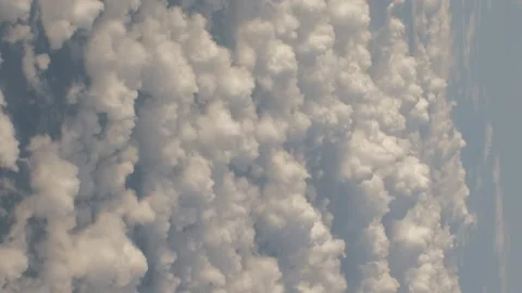 Fluffy Clouds from Above while Flying in a Plane 스톡 동영상 162671373