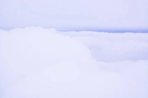 Fluffy Clouds Blue Line Fluffy Clouds Blue Line. Cloud cover in flight, ar... Stock Photos