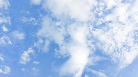 Fluffy clouds. Blue sky with clouds, perfect for background imagery. Stock Photos