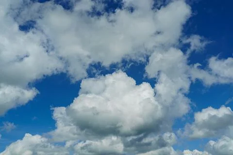 Fluffy clouds in the blue sky. Cloudscape Stock Photos