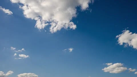 Fluffy clouds on a blue sky forming and disappearing time lapse Stock Footage 293055821