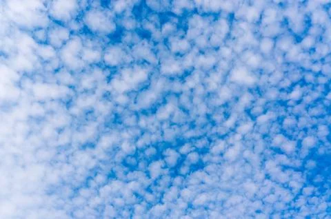 Fluffy clouds on the blue sky Stock Photos