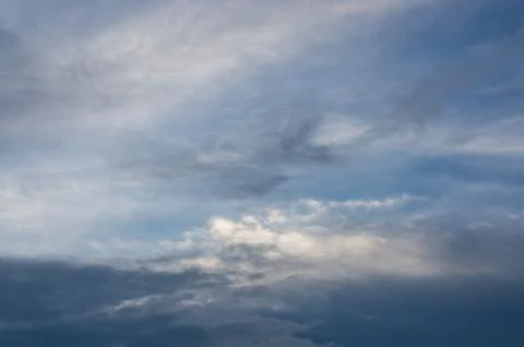 Fluffy clouds on the blue sky Stock Photos