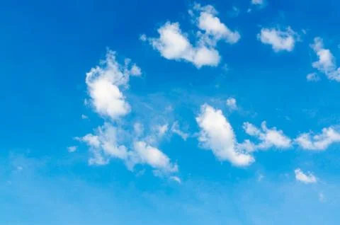Fluffy clouds on the blue sky Stock Photos