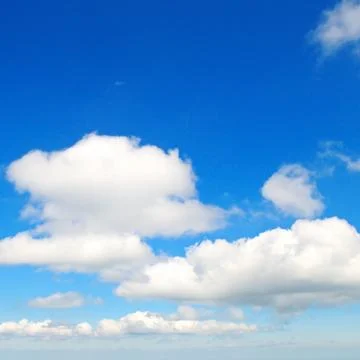 Fluffy clouds in the blue sky Stock Photos