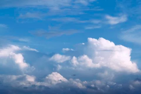 Fluffy clouds in a blue sky Stock Photos