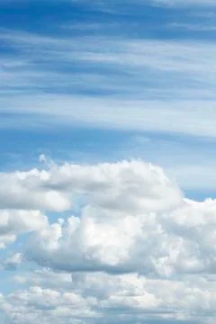 Fluffy clouds in a blue sky Stock Photos