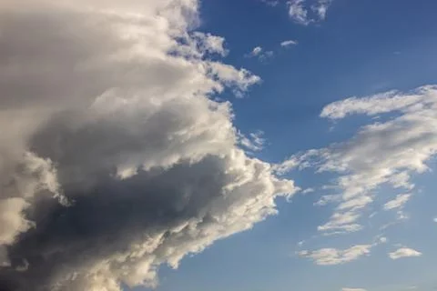 Fluffy clouds in the blue sky Stock Photos