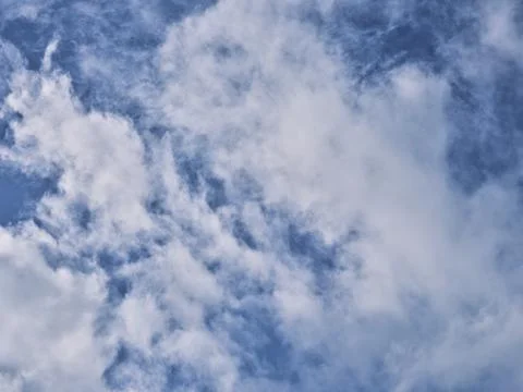 Fluffy clouds in the blue sky Stock Photos