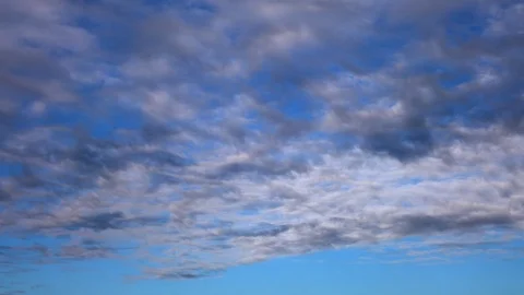 Fluffy clouds on bright blue sky moving fas. 4K time lapse. 動画素材 96025445