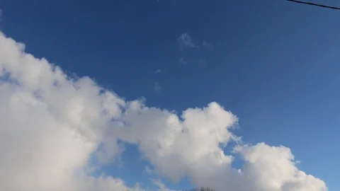 Fluffy clouds on a bright blue sky Video stock 104644388
