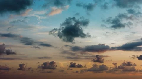 Fluffy Clouds Drift across a Beautiful Tropical Sunset Sky Stock Footage 50398966