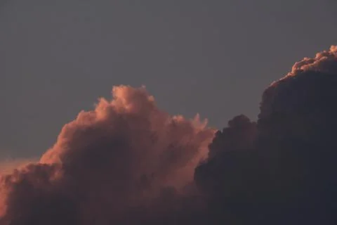 Fluffy clouds during sunrise with copyspace, dreamy look Stock Photos