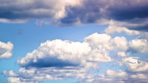Fluffy clouds floating in blue sky Stock Footage 76104229