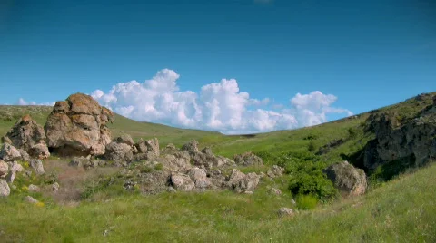 Fluffy clouds flying above meadow Video stock 453829