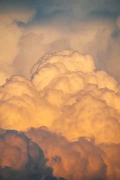 Fluffy clouds Flying on a drone in the clouds. Sunset light. Stock Photos