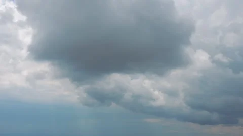 Fluffy clouds forming beautiful patterns in the sky in 4k slow motion 60fps Stock Footage 284216728