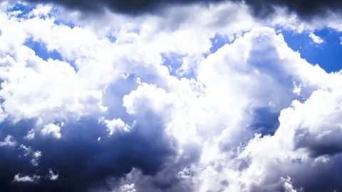 Fluffy clouds moving in blue sky Stock Footage 76199340