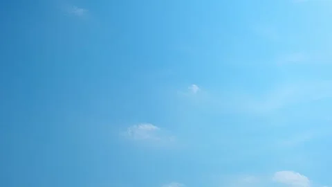 Fluffy clouds moving in the blue sky time-lapse Video stock 242639965