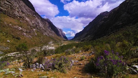 Fluffy clouds moving over beautiful mountain range Stock Footage 77482898