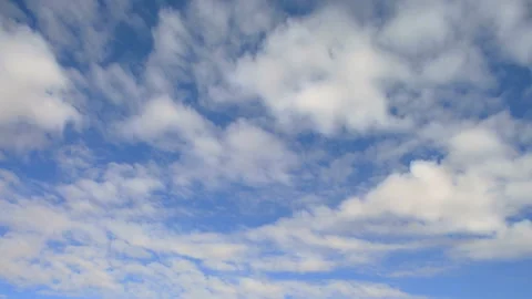 Fluffy clouds moving from right to left in the sky Stock Footage 96450285