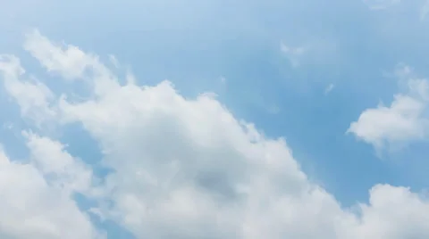 Fluffy clouds over blue sky timelapse Stock Footage 37006739