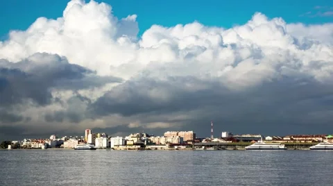 Fluffy Clouds over City and Ferry Terminal Stock Footage 59710981