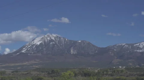 Fluffy clouds over mountain range Stock Footage 68536169