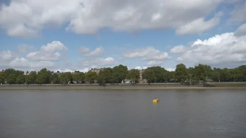 Fluffy clouds over Thames riverside. Stock Footage 114984671