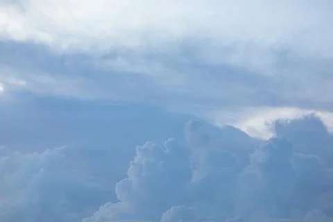 Fluffy Clouds in an Overcast Sky Fotos de archivo
