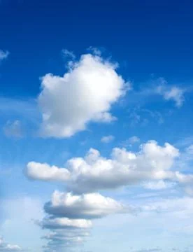 Fluffy Clouds In a Row Stock Photos