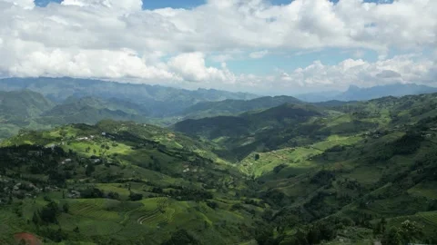 Fluffy Clouds Shadows Moving Over Green Hills in Ha Giang, Vietnam Stock Footage 334618917
