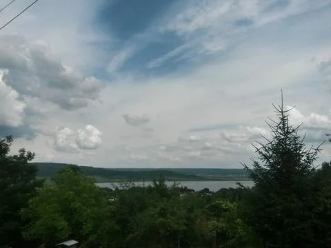 Fluffy clouds on the sky. cloudy day in the forest Stock Photos