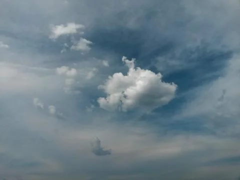 Fluffy clouds on the sky. cloudy day in the forest Stock Photos
