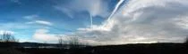 Fluffy clouds on the sky. cloudy day in the forest Stock Photos