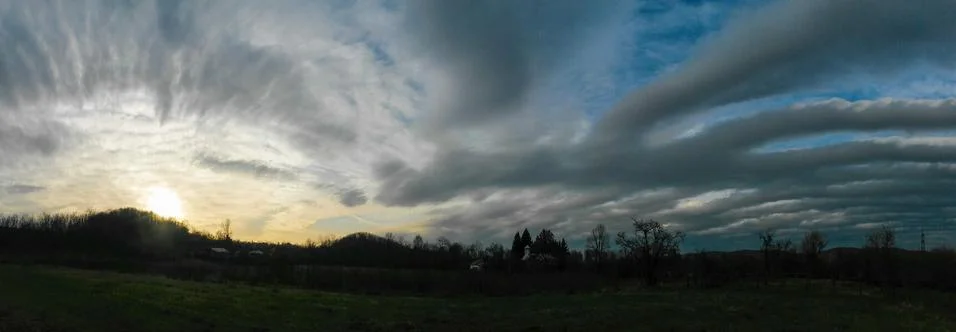 Fluffy clouds on the sky. cloudy day in the forest Stock Photos