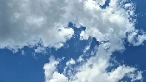 Fluffy clouds in the sky Stock Footage 283097959