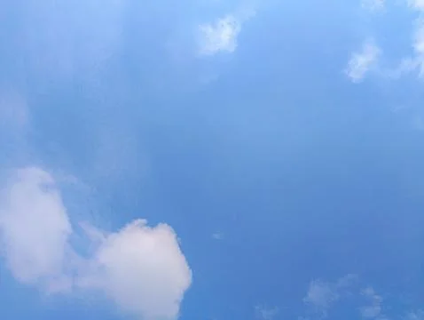 Fluffy Cloudscape: A Serene Blue Sky Background Stock Photos