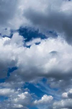 Fluffy cloudy blue sky scape Stock Photos