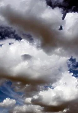 Fluffy cloudy deep blue sky scape 051 Stock Photos