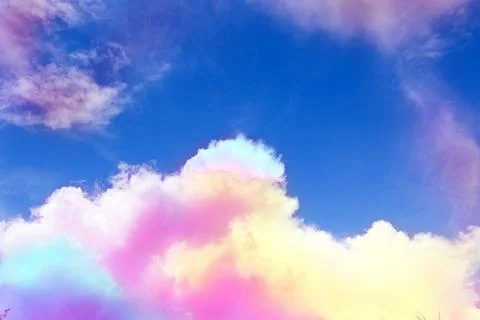 Fluffy color clouds floating in beautiful blue sky Stock Photos