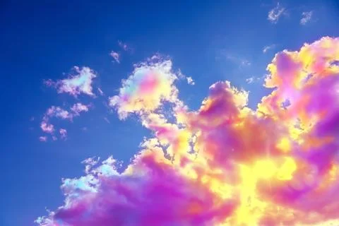 Fluffy color clouds floating in beautiful blue sky Stock Photos