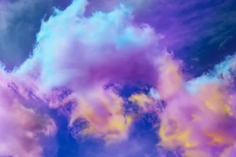 Fluffy color clouds floating in beautiful blue sky Stock Photos